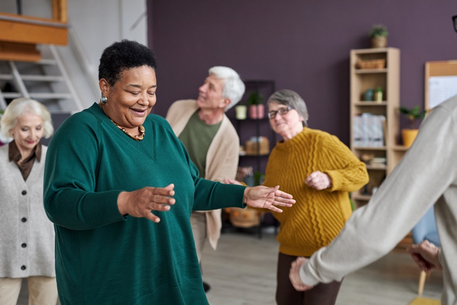 Group of older adults dancing.
